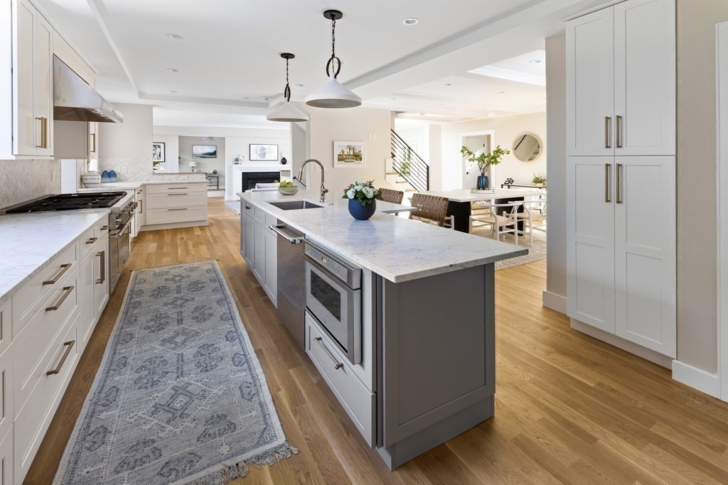 111 Jordan Road Brookline, MA 02446 - Photo 9 of 42 a kitchen with stainless steel appliances granite countertop lots of counter top space and wooden floor