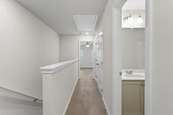a view of a hallway with a white walls