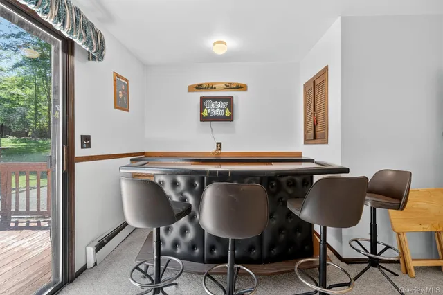 a blue table with chairs and a window