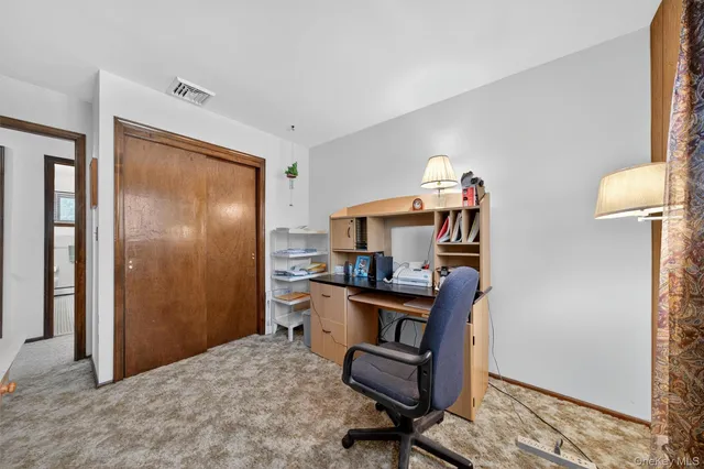 a workspace with furniture and a window