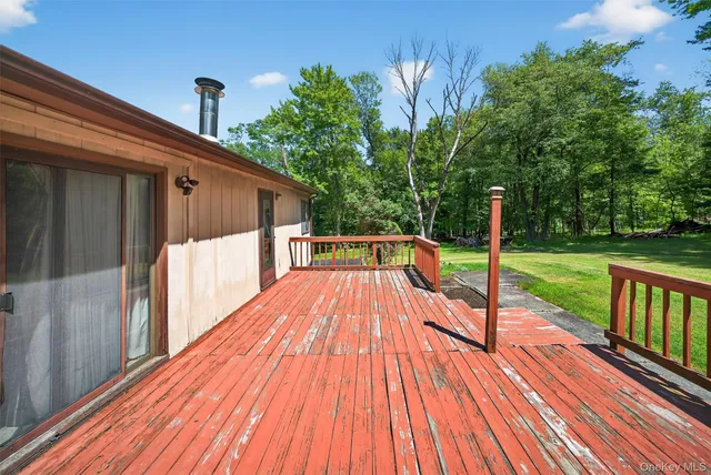 a view of a backyard with a sitting area
