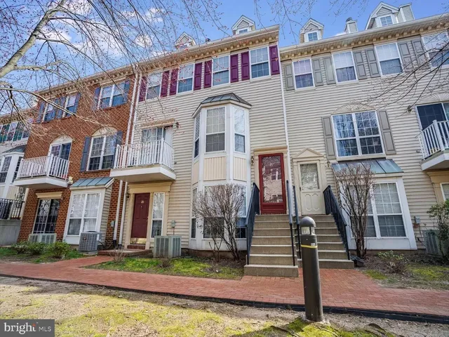 a front view of a building with garden