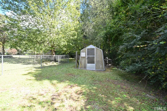 a view of backyard with green space