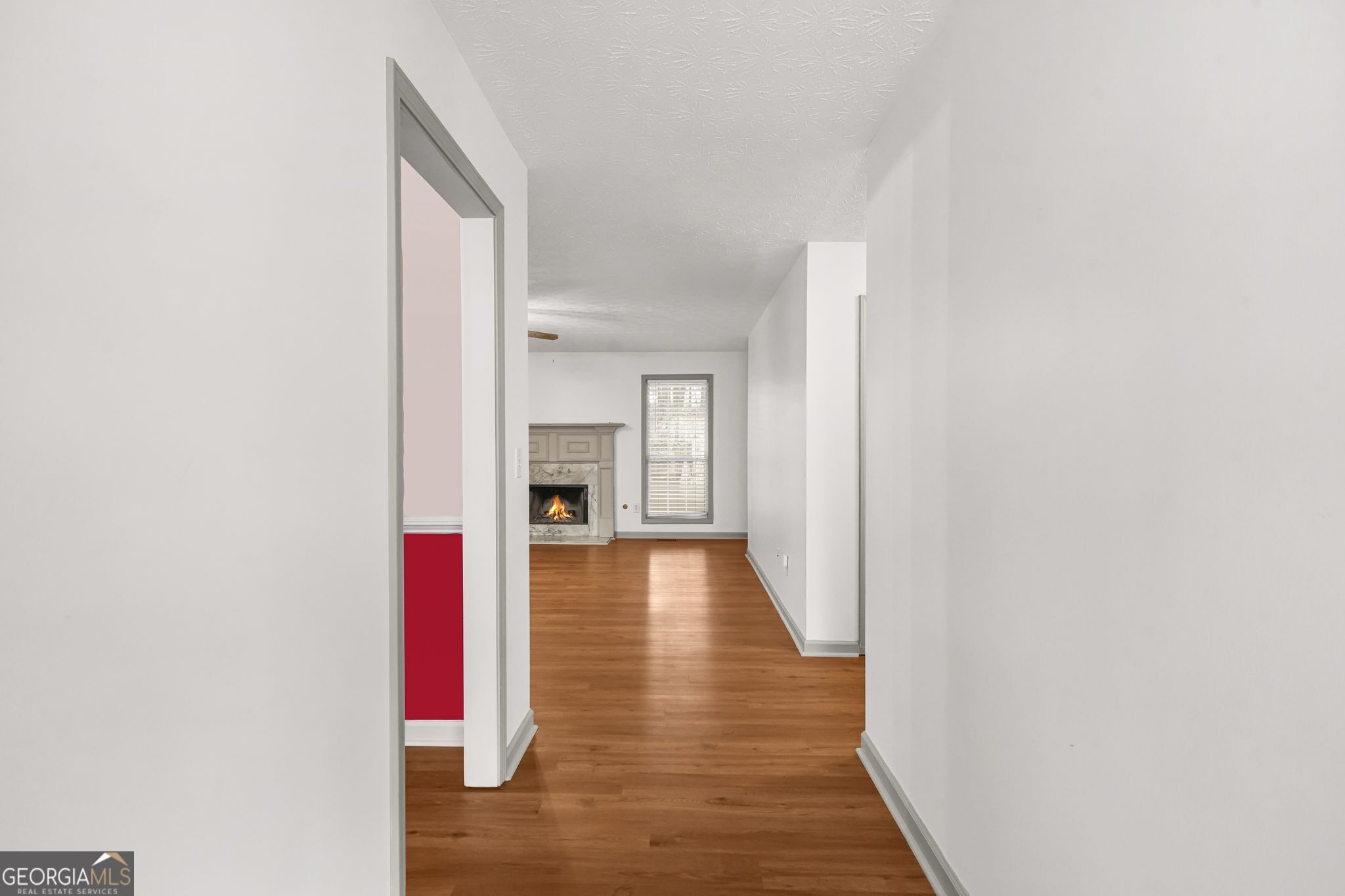 156 Pine Street Covington, GA 30014 - Photo 11 of 37 a view of a hallway with wooden floor
