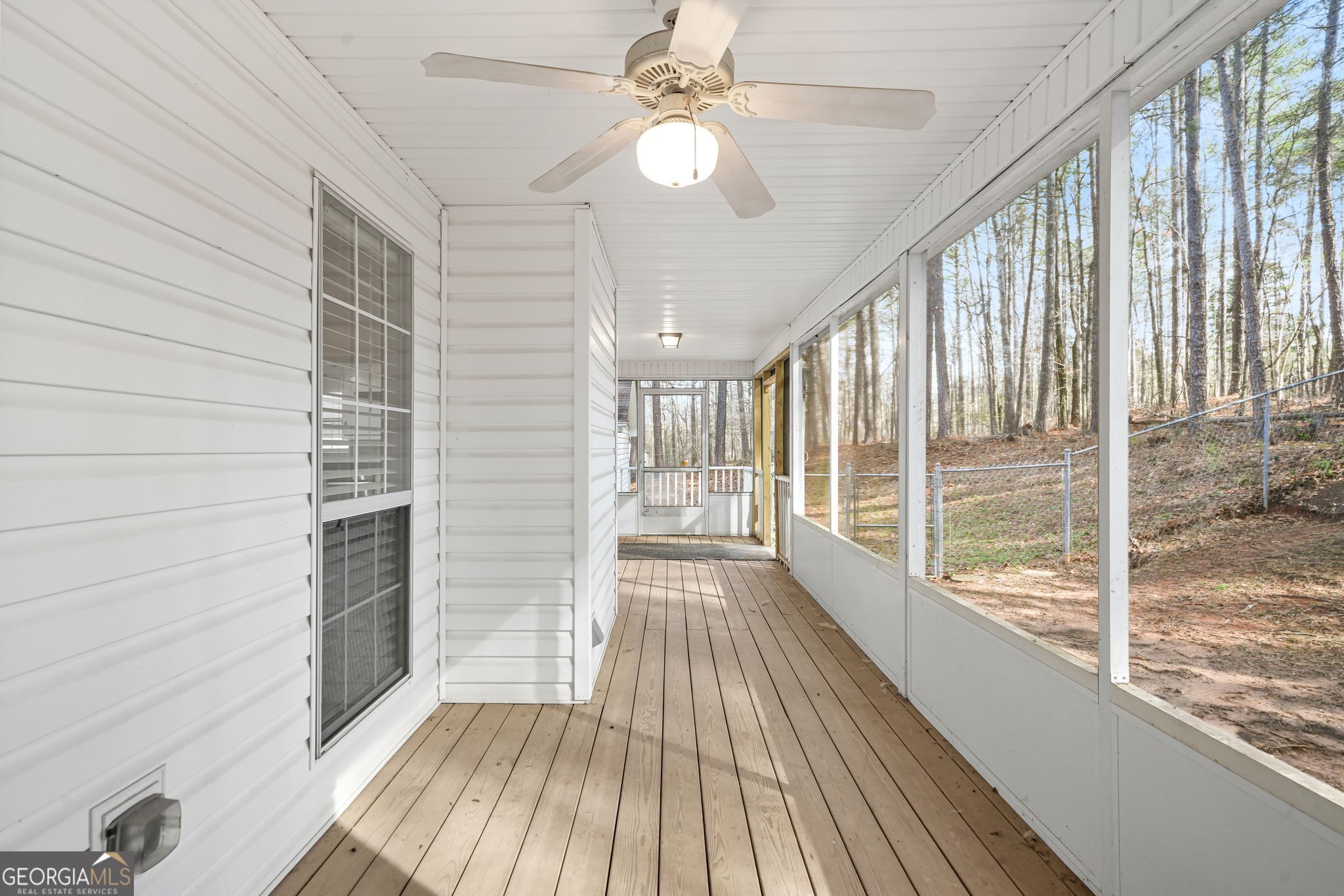 156 Pine Street Covington, GA 30014 - Photo 2 of 37 a view of a room with wooden floor and windows