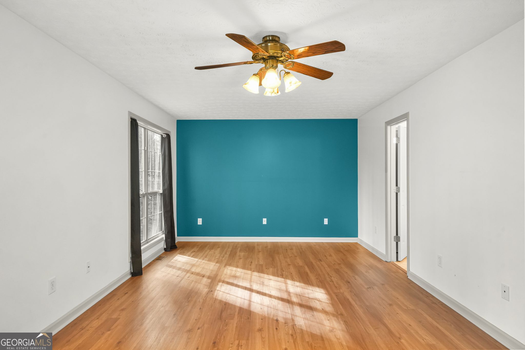 156 Pine Street Covington, GA 30014 - Photo 21 of 37 a view of empty room with wooden floor