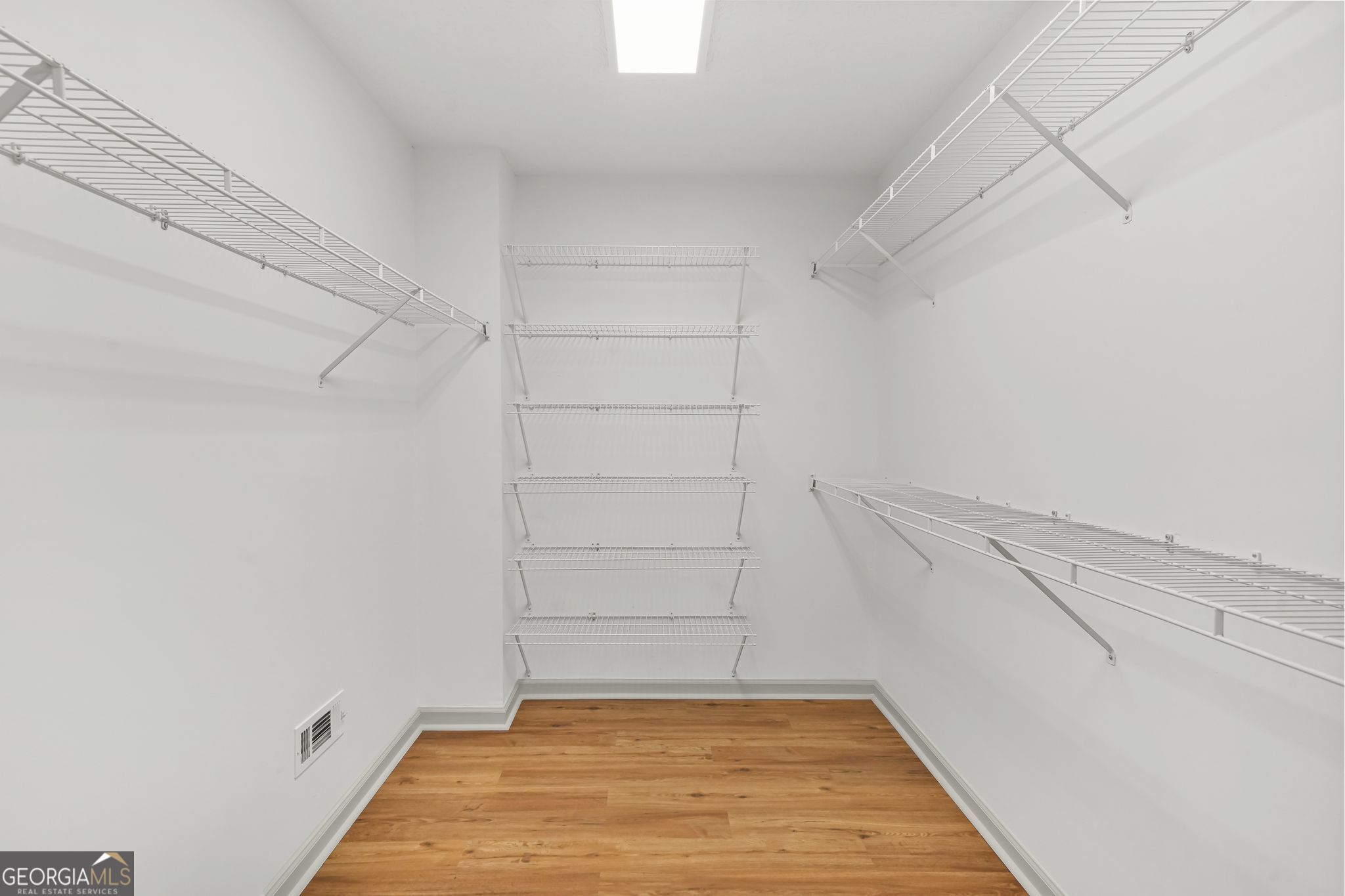 156 Pine Street Covington, GA 30014 - Photo 22 of 37 a view of an empty walk in closet