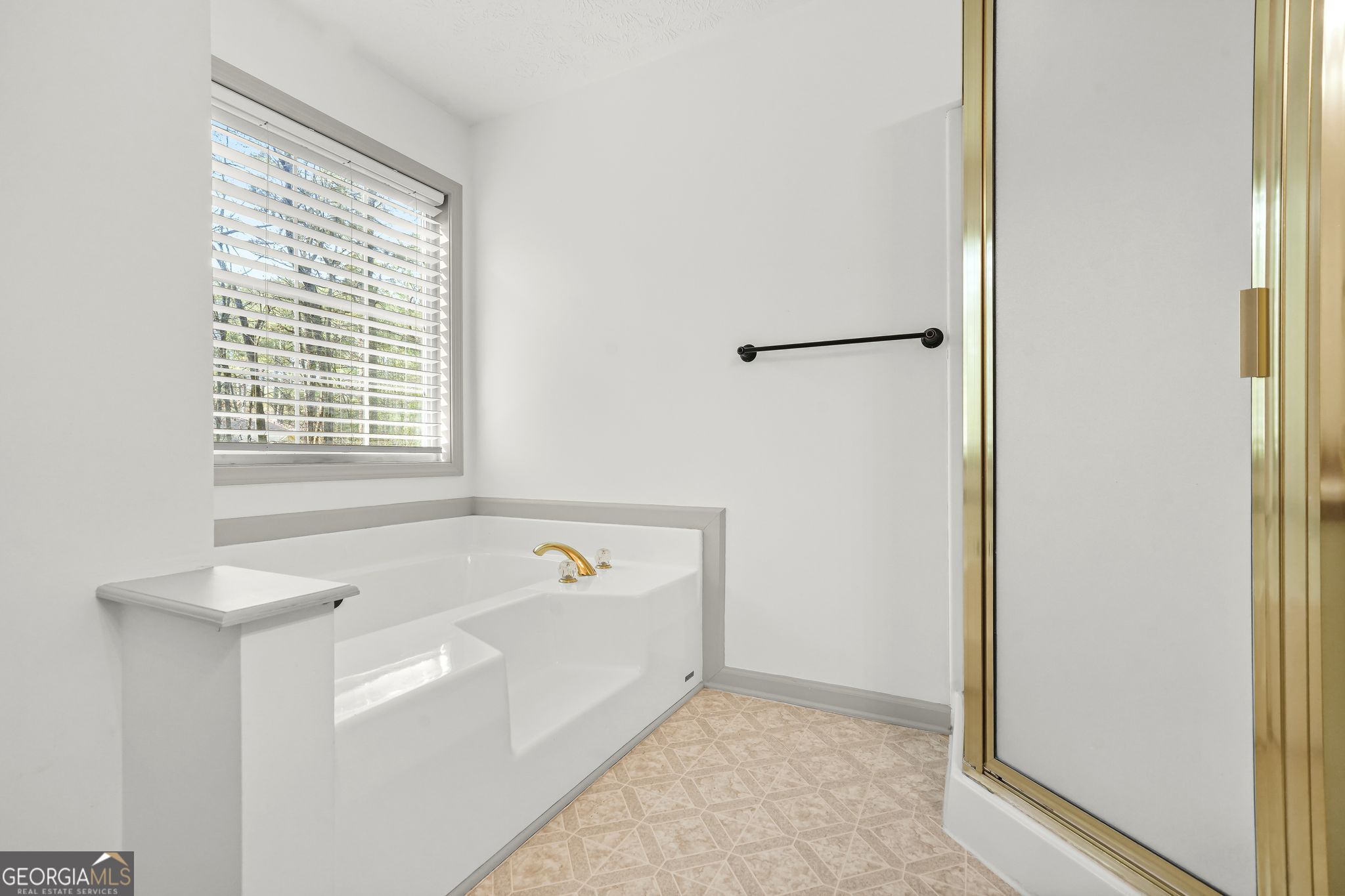 156 Pine Street Covington, GA 30014 - Photo 26 of 37 a bathroom with a bathtub and a shower