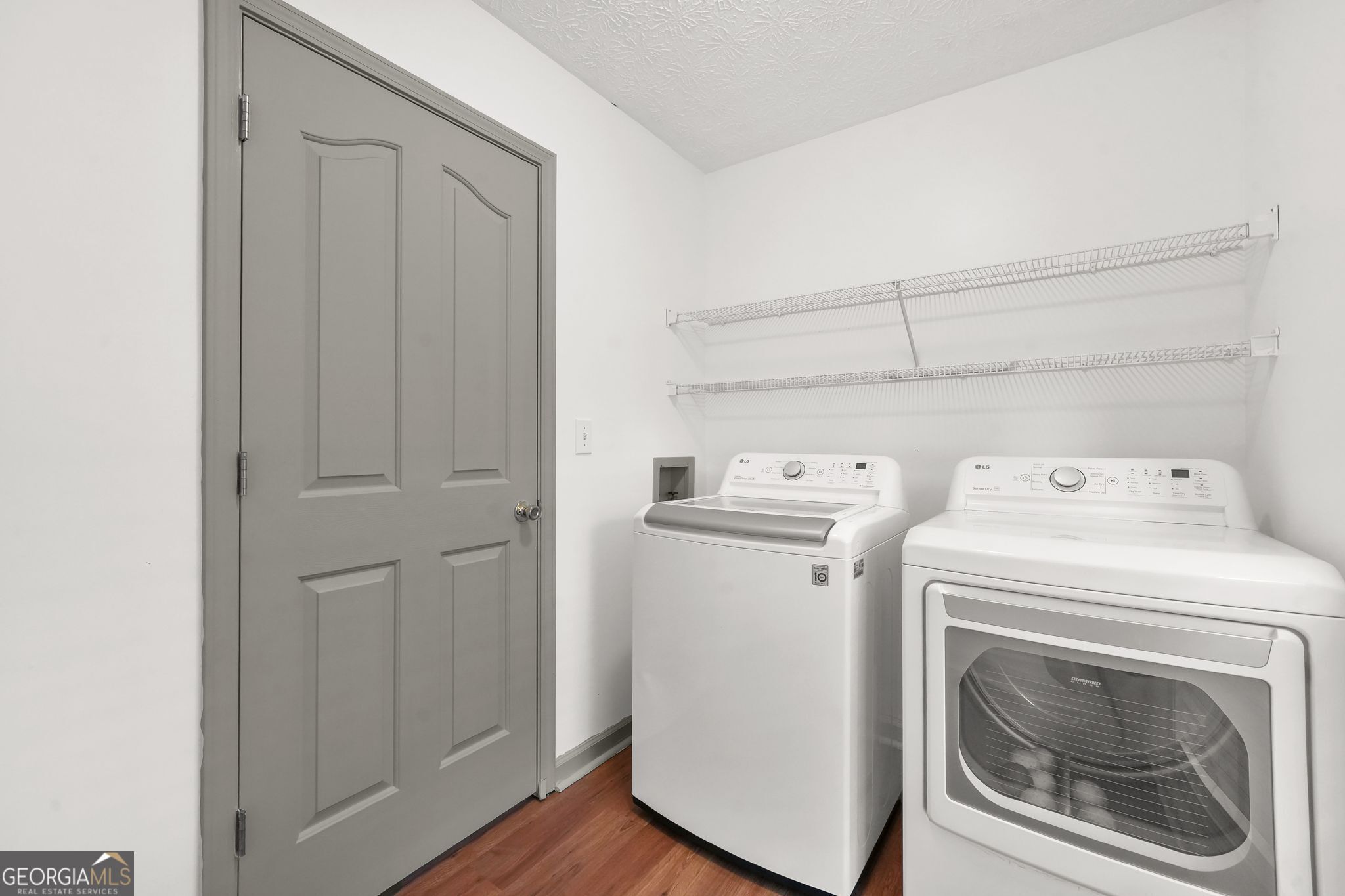 156 Pine Street Covington, GA 30014 - Photo 32 of 37 a utility room with dryer and washer