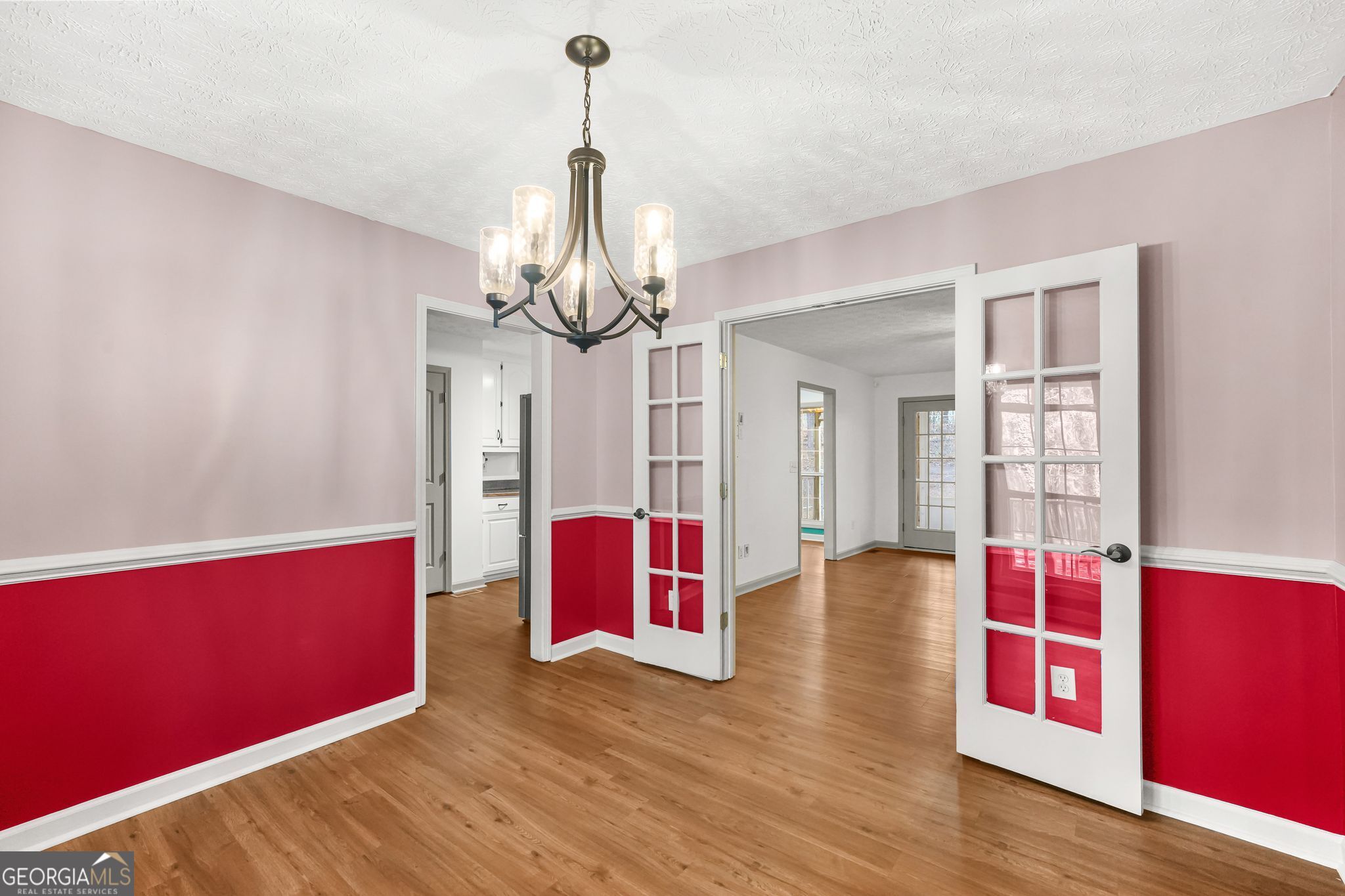 156 Pine Street Covington, GA 30014 - Photo 7 of 37 a view of empty room with wooden floor and fan