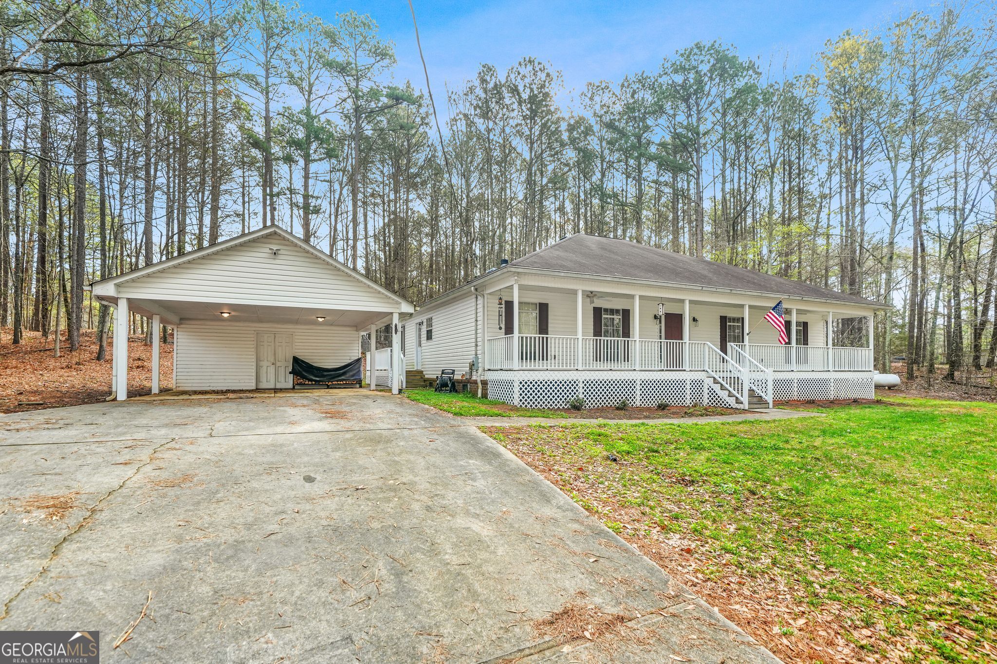156 Pine Street Covington, GA 30014 - Photo 9 of 37 a front view of a house with a garden and trees
