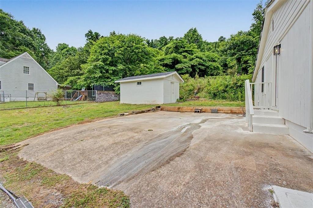 2115 King Road Dalton, GA 30720 - Photo 37 of 54 a view of a house with a yard and garage