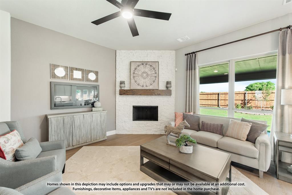 315 Spring Circle Red Oak, TX 75154 - Photo 11 of 40 a living room with furniture a large window and a fireplace