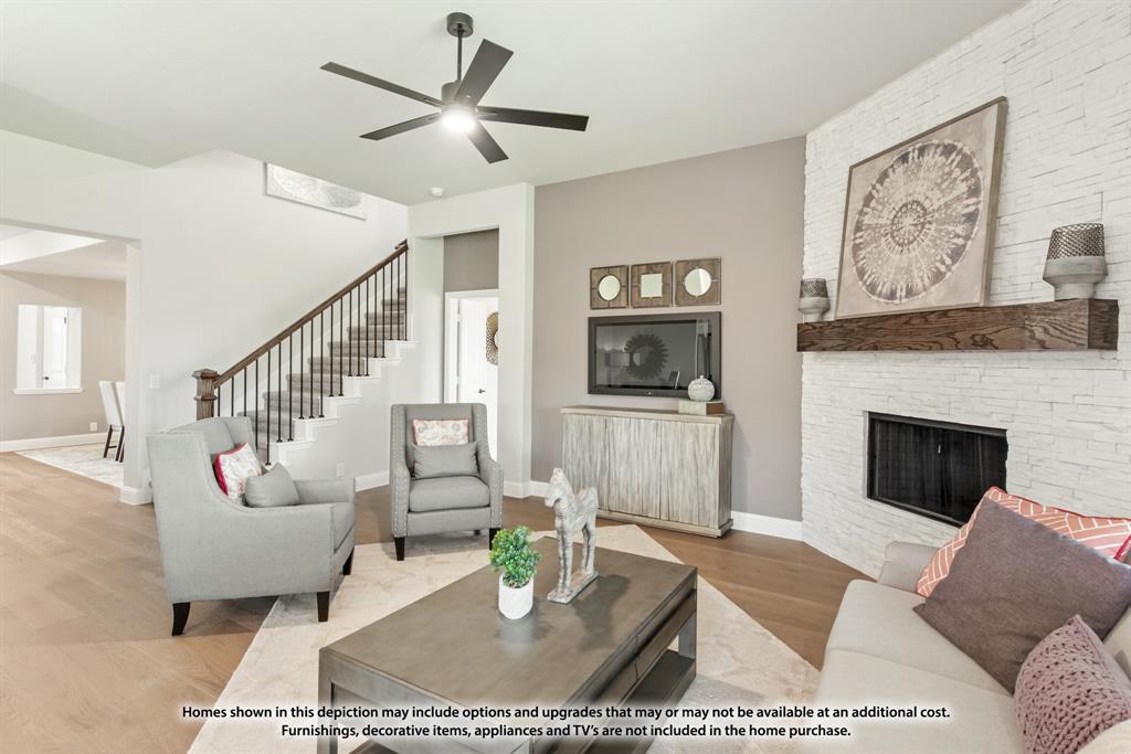 315 Spring Circle Red Oak, TX 75154 - Photo 15 of 40 a living room with furniture a rug and a fireplace