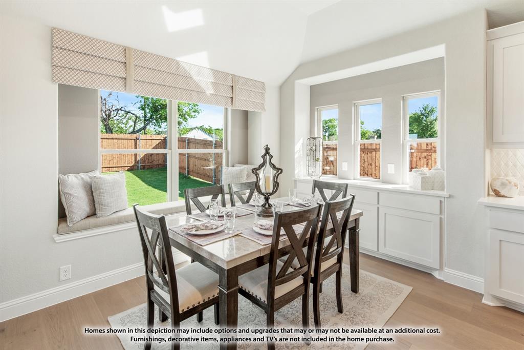 315 Spring Circle Red Oak, TX 75154 - Photo 20 of 40 a view of a dining room with furniture large windows and wooden floor
