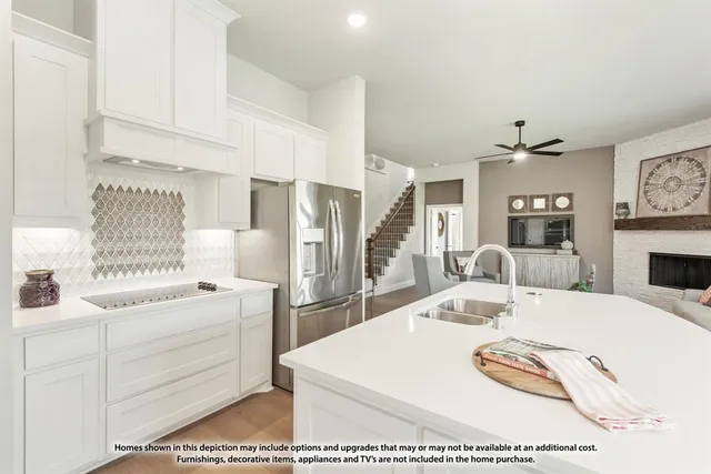 a living room with furniture and a lamp