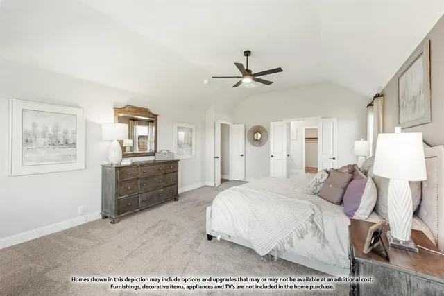 a bedroom with a bed a desk and chair