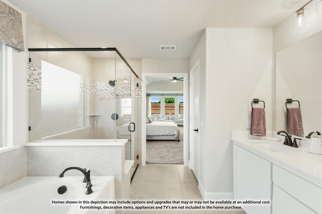 315 Spring Circle Red Oak, TX 75154 - Photo 25 of 40 a bathroom with a tub a sink and a mirror