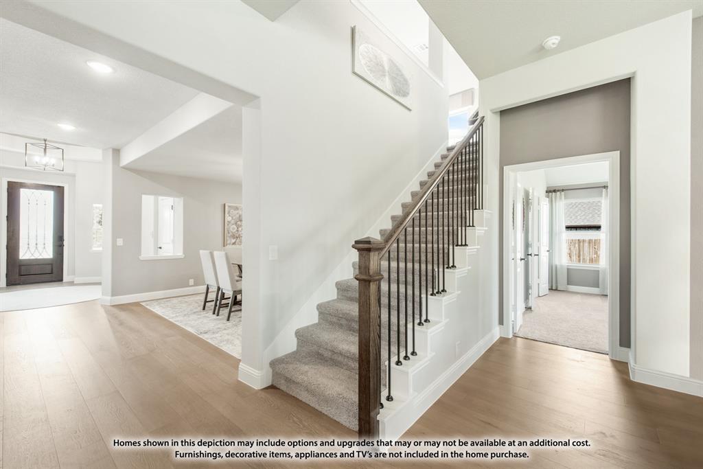 315 Spring Circle Red Oak, TX 75154 - Photo 28 of 40 a view of a hallway with wooden floor and staircase