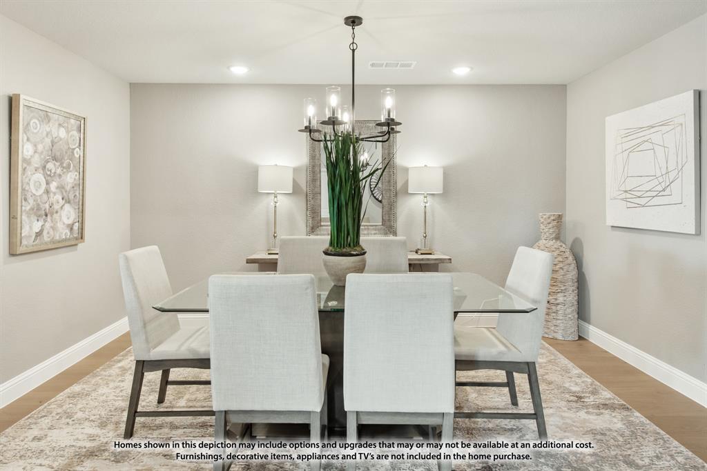 315 Spring Circle Red Oak, TX 75154 - Photo 6 of 40 a dining room with furniture a rug and wooden floor