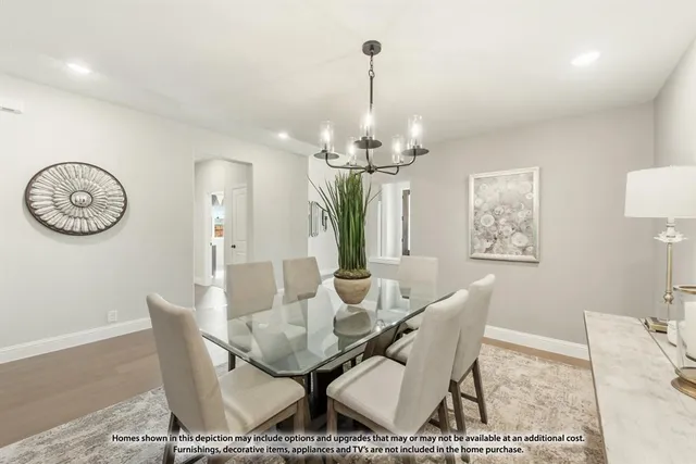 a living room with furniture a large window and a fireplace