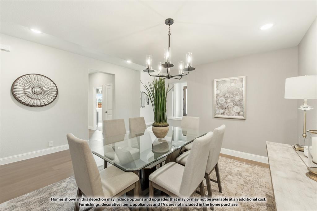 315 Spring Circle Red Oak, TX 75154 - Photo 7 of 40 a view of a dining room with furniture and a chandelier