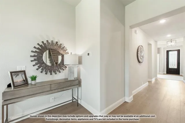 a living room with furniture a rug and white walls