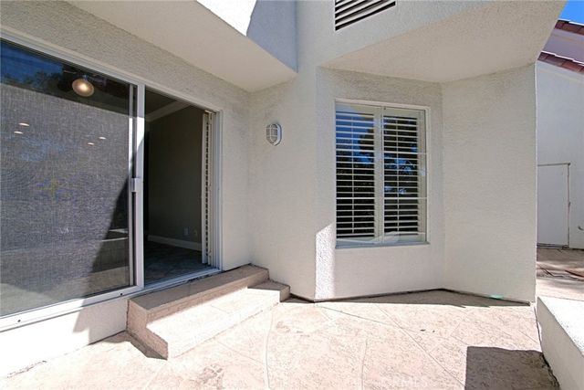 a view of hallway with wooden floor