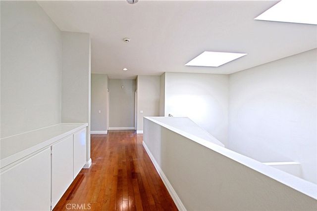 a spacious bathroom with a double vanity sink mirror and bathtub