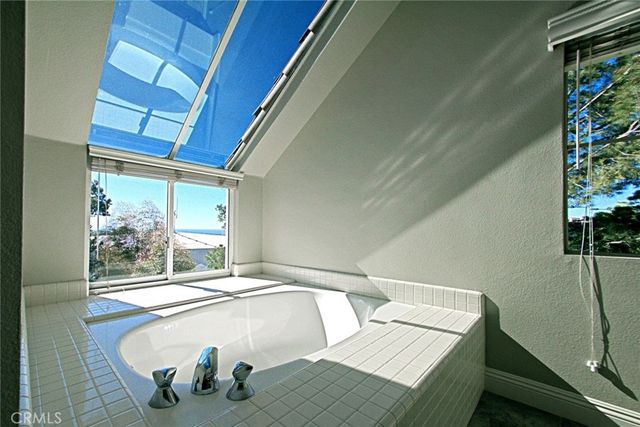 an aerial view of a house with garden space and street view