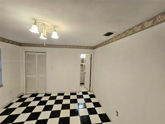 a view of a livingroom with a ceiling fan and a rug