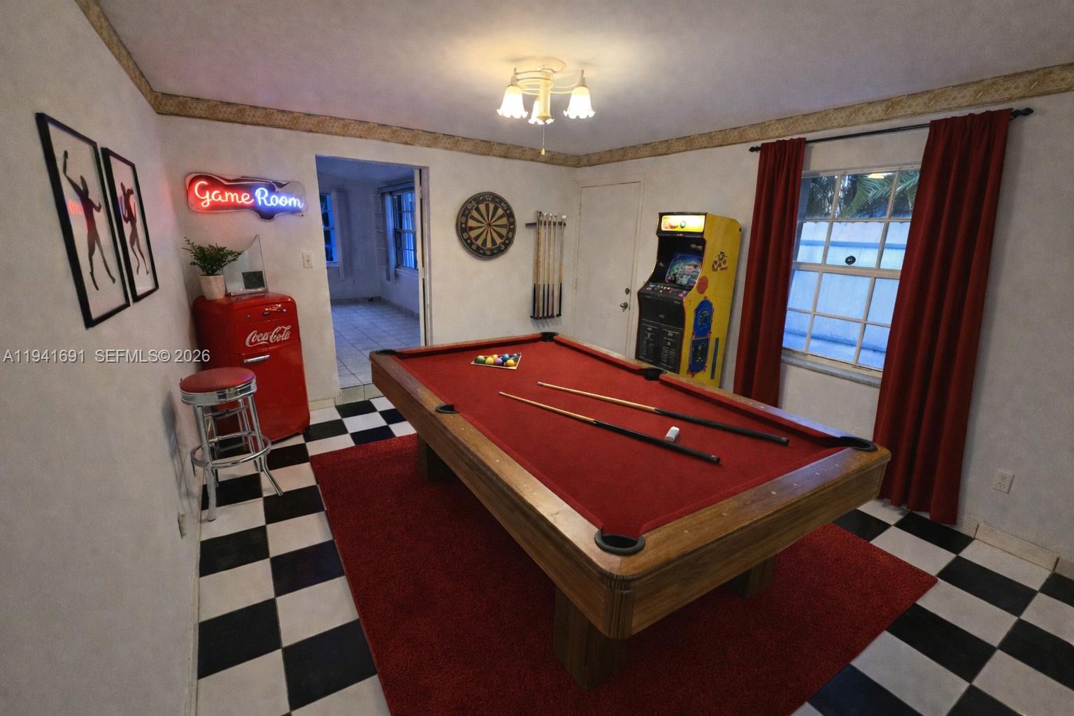 3015 Southwest 24th Terrace Miami, FL 33145 - Photo 12 of 22 a room with gym equipment and a mirror