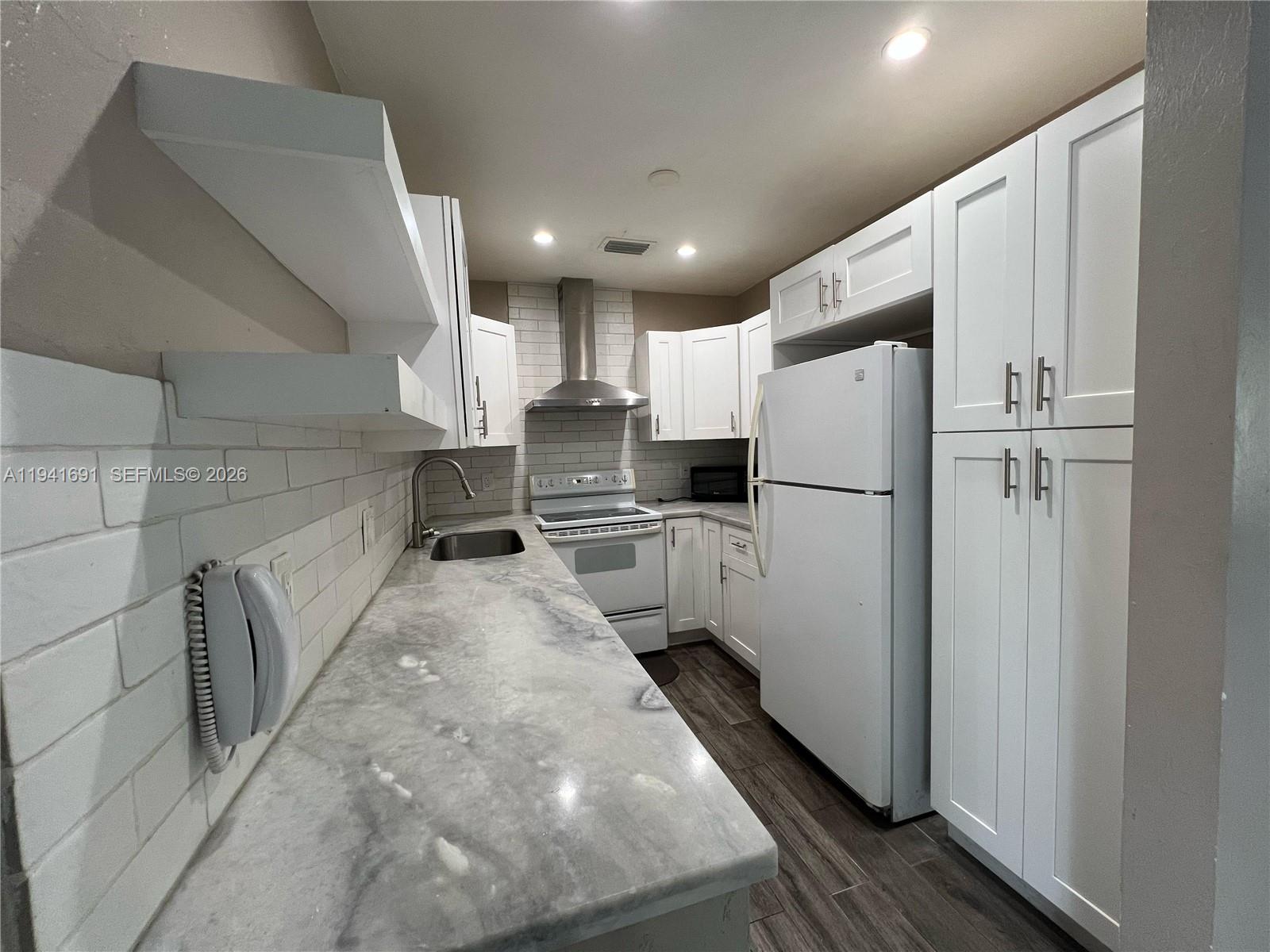 3015 Southwest 24th Terrace Miami, FL 33145 - Photo 5 of 22 a kitchen with refrigerator and countertop
