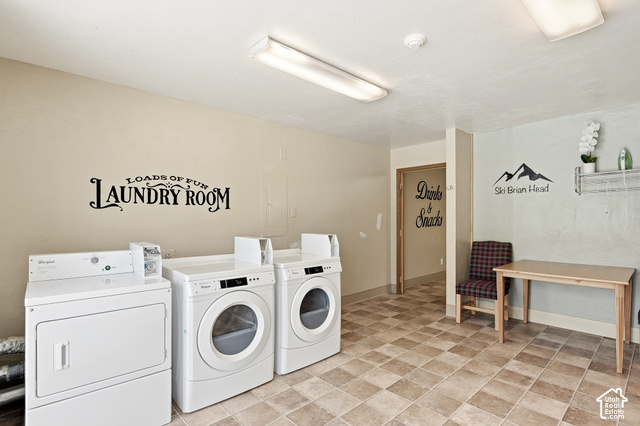 150 Ridgeview Street Brian Head, UT 84719 - Photo 26 of 43 Dedicated laundry area with tiled flooring, multiple washer and dryer hookups, and integrated overhead lighting