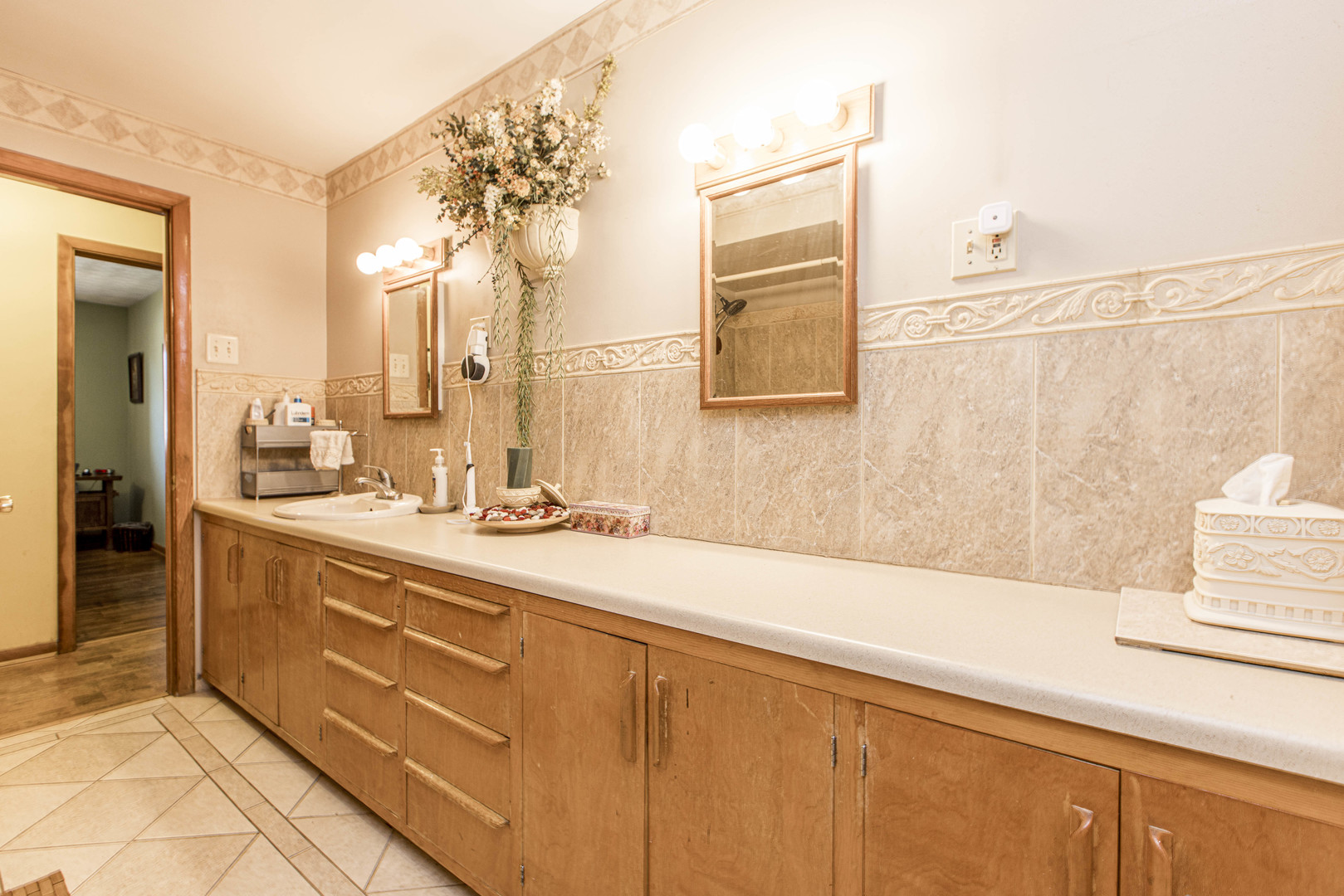 17 Szarek Drive Bloomington, IL 61701 - Photo 15 of 33 a spacious bathroom with a double vanity sink a mirror and a bathtub