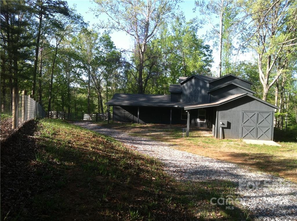 2475 Hunting Country Road Tryon, NC 28782 - Photo 1 of 6 a view of a house with a yard