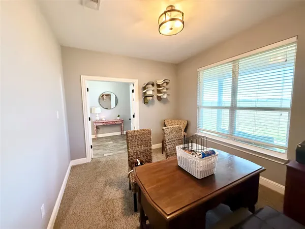 a view of a dining room with furniture window and outside view