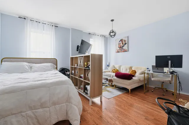 a bedroom with bed and a window