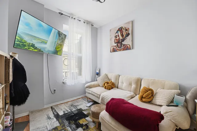 a bedroom with furniture and a window