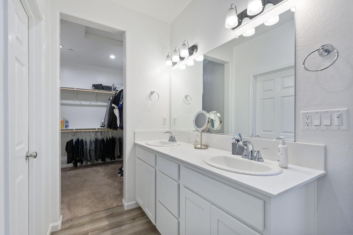 282 Rosebriar Street Madera, CA 93638 - Photo 16 of 28 a bathroom with a sink double vanity and a mirror