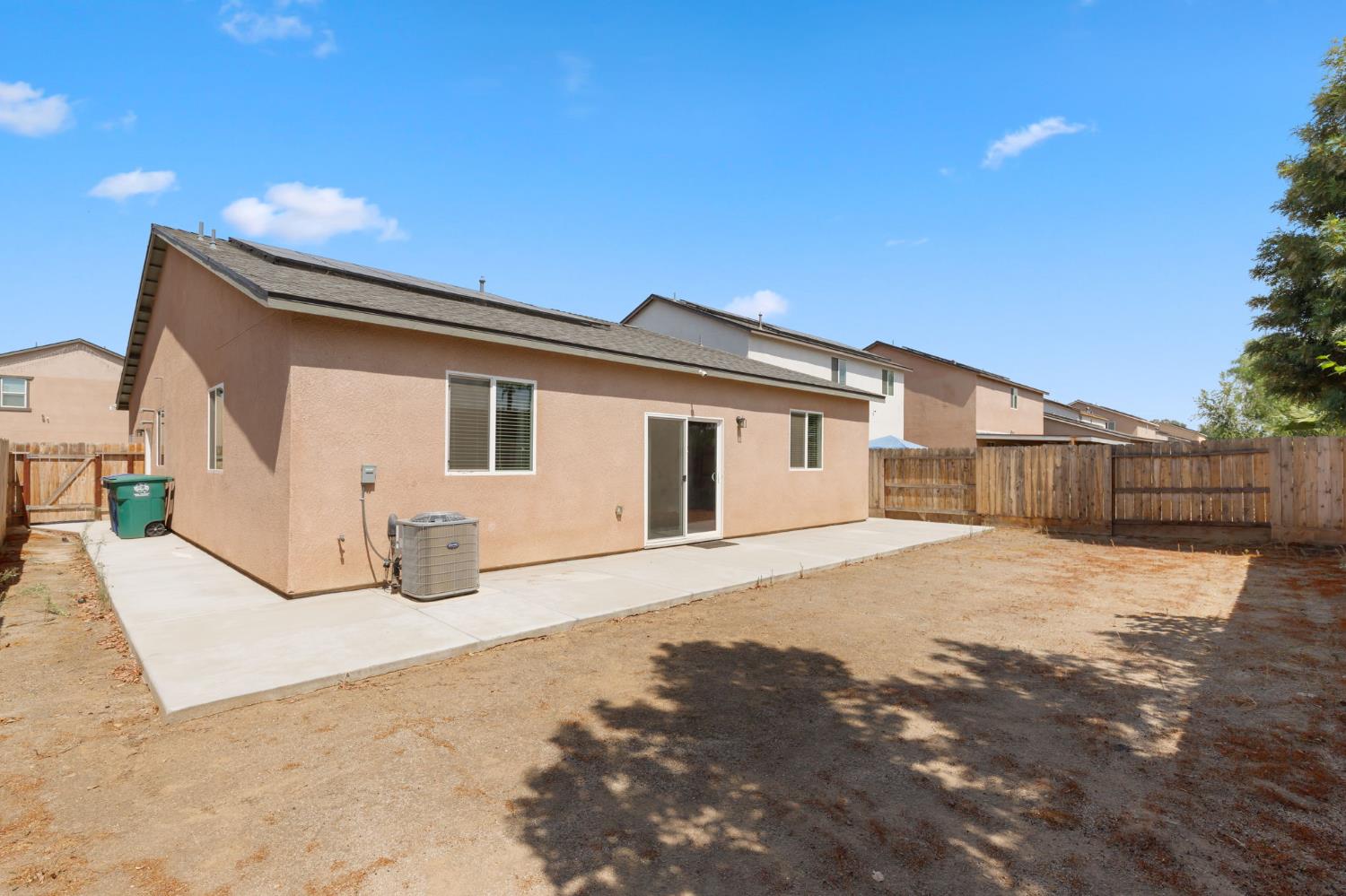 282 Rosebriar Street Madera, CA 93638 - Photo 25 of 28 a front view of a house with a yard