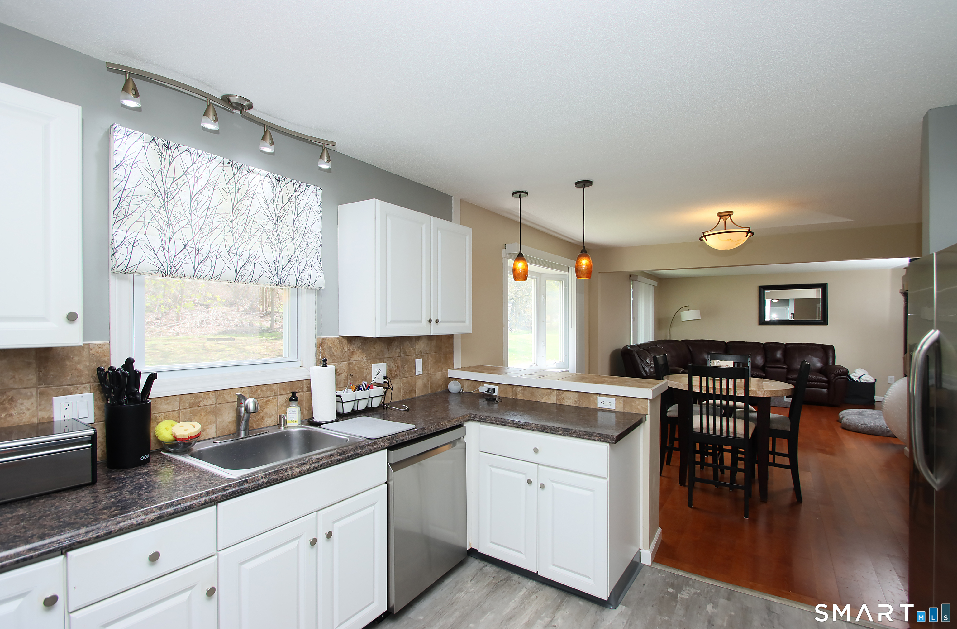 494 Tunnel Road Vernon, CT 06066 - Photo 4 of 22 Open floorpan. View from kitchen into family room.