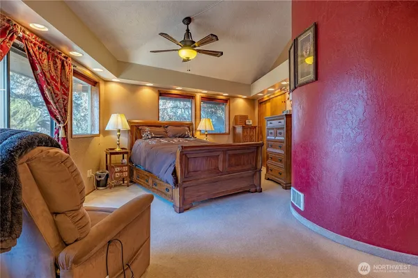 a bedroom with bed and window