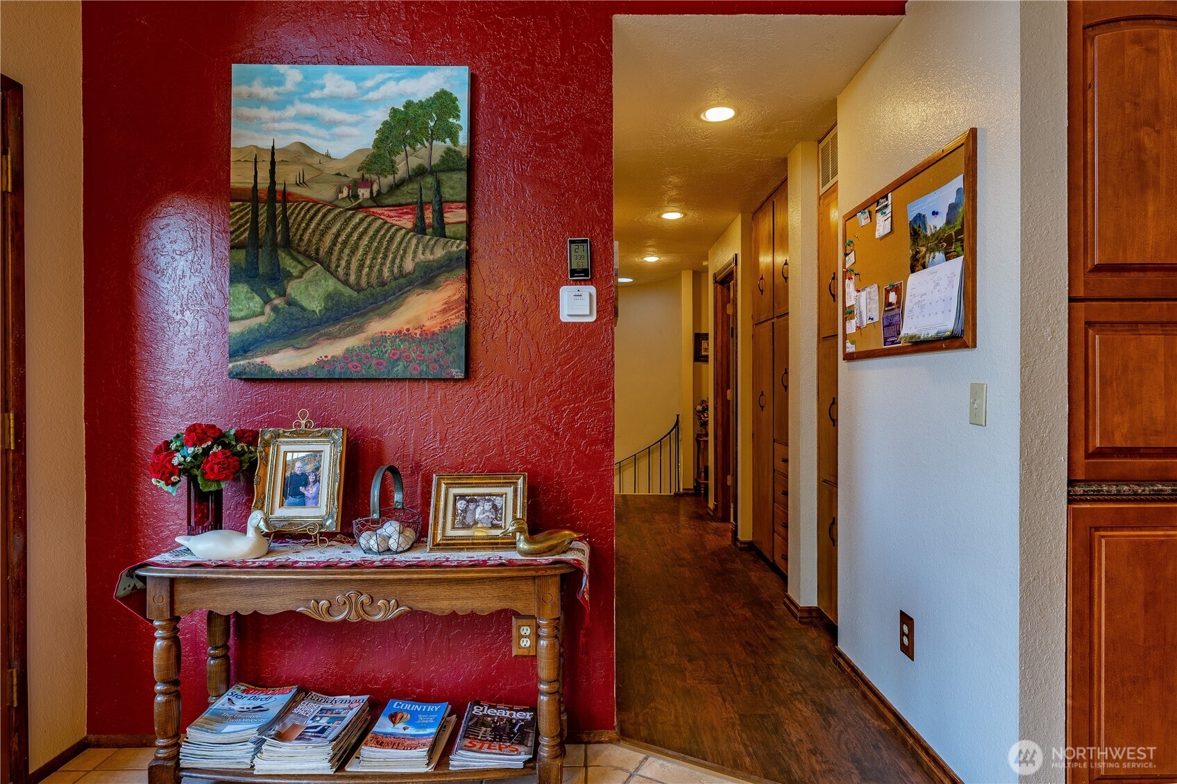 826 South Skylark Way Othello, WA 99344 - Photo 17 of 40 a view of a hallway with furniture and wooden floor