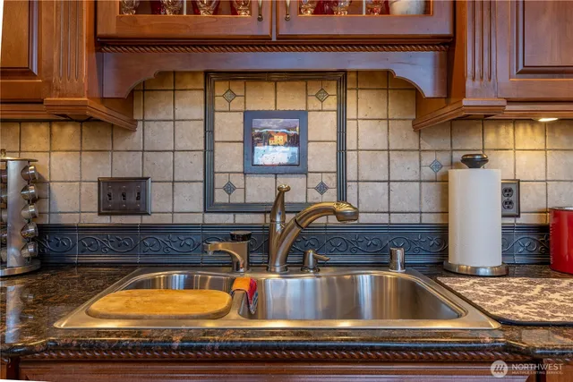 a kitchen with a sink and a window