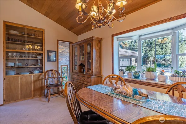 a living room with furniture and a baby crib