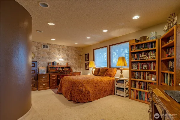 a view of a chair and tables in the balcony