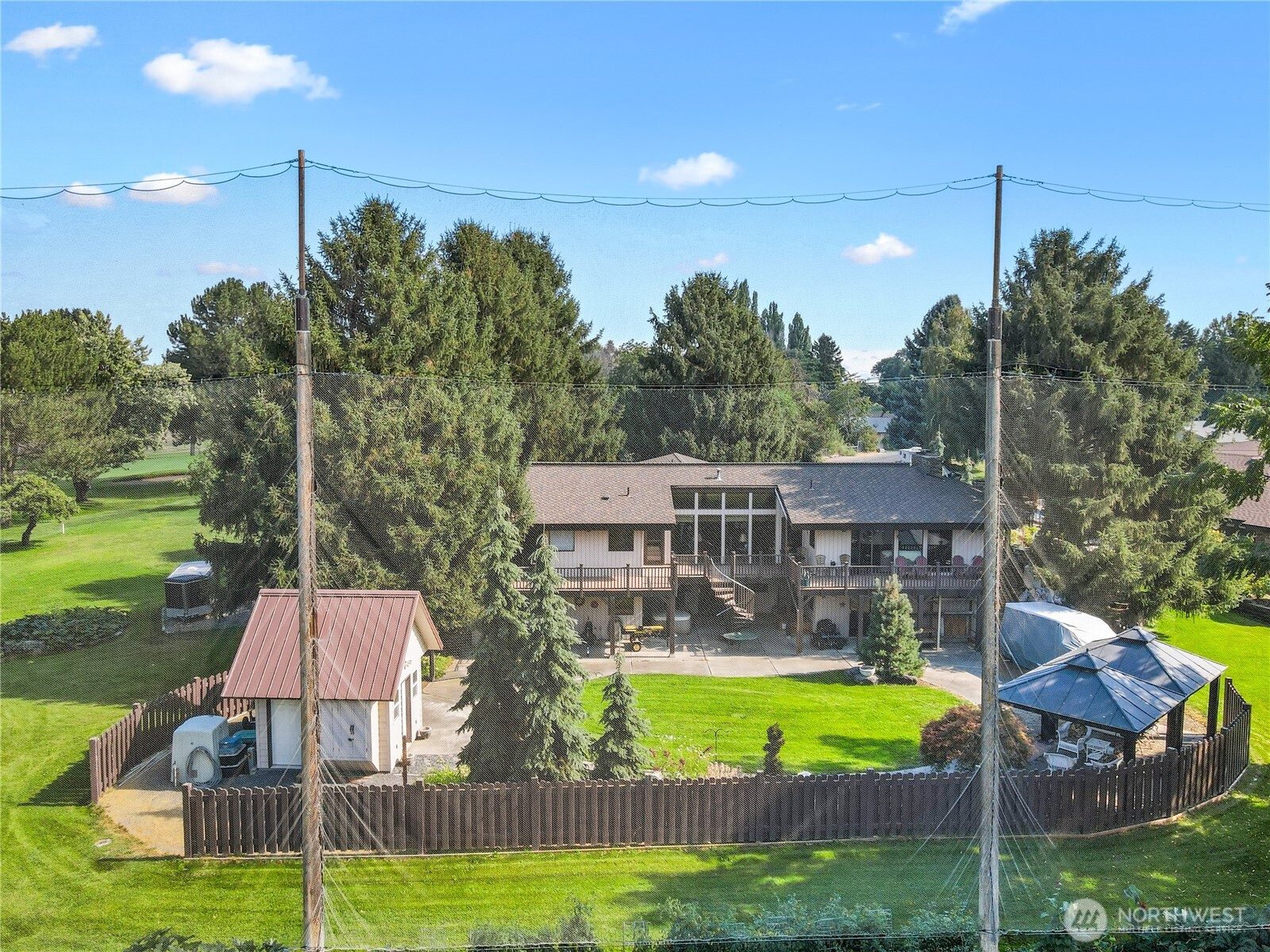 826 South Skylark Way Othello, WA 99344 - Photo 6 of 40 a view of a swimming pool with a garden and plants