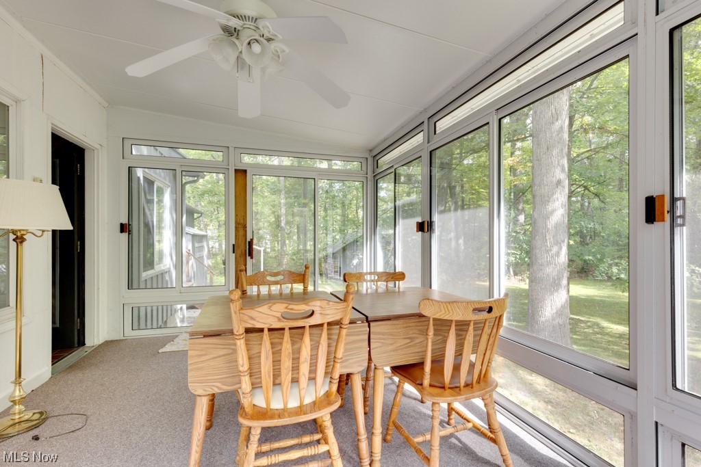 4616 Alliance Road Ravenna, OH 44266 - Photo 21 of 28 Sunroom featuring a healthy amount of sunlight and ceiling fan