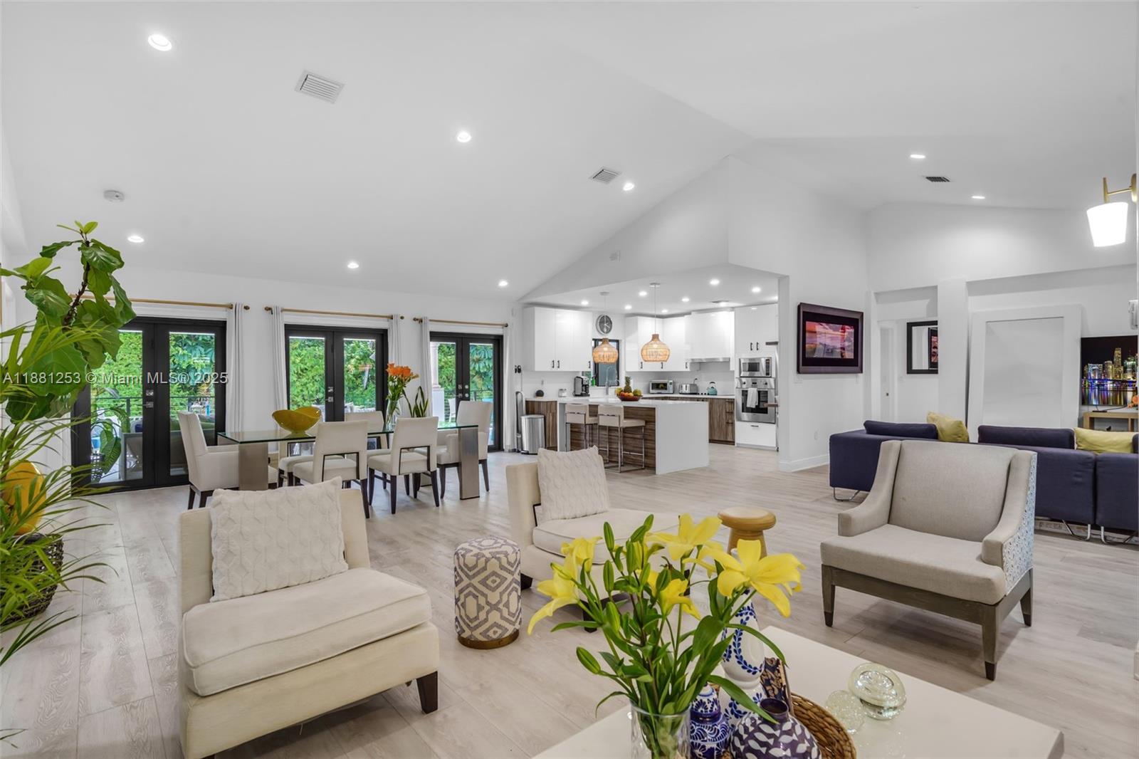 340 Woodcrest Road Key Biscayne, FL 33149 - Photo 1 of 51 a living room with furniture and a view of kitchen